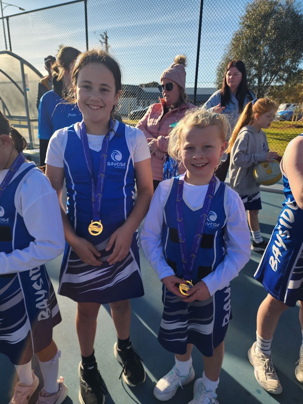 Two young players showing their medals