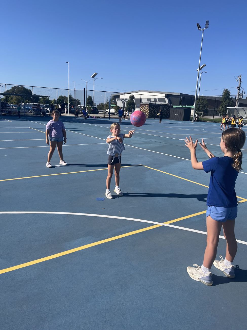 Young players passing a ball at training