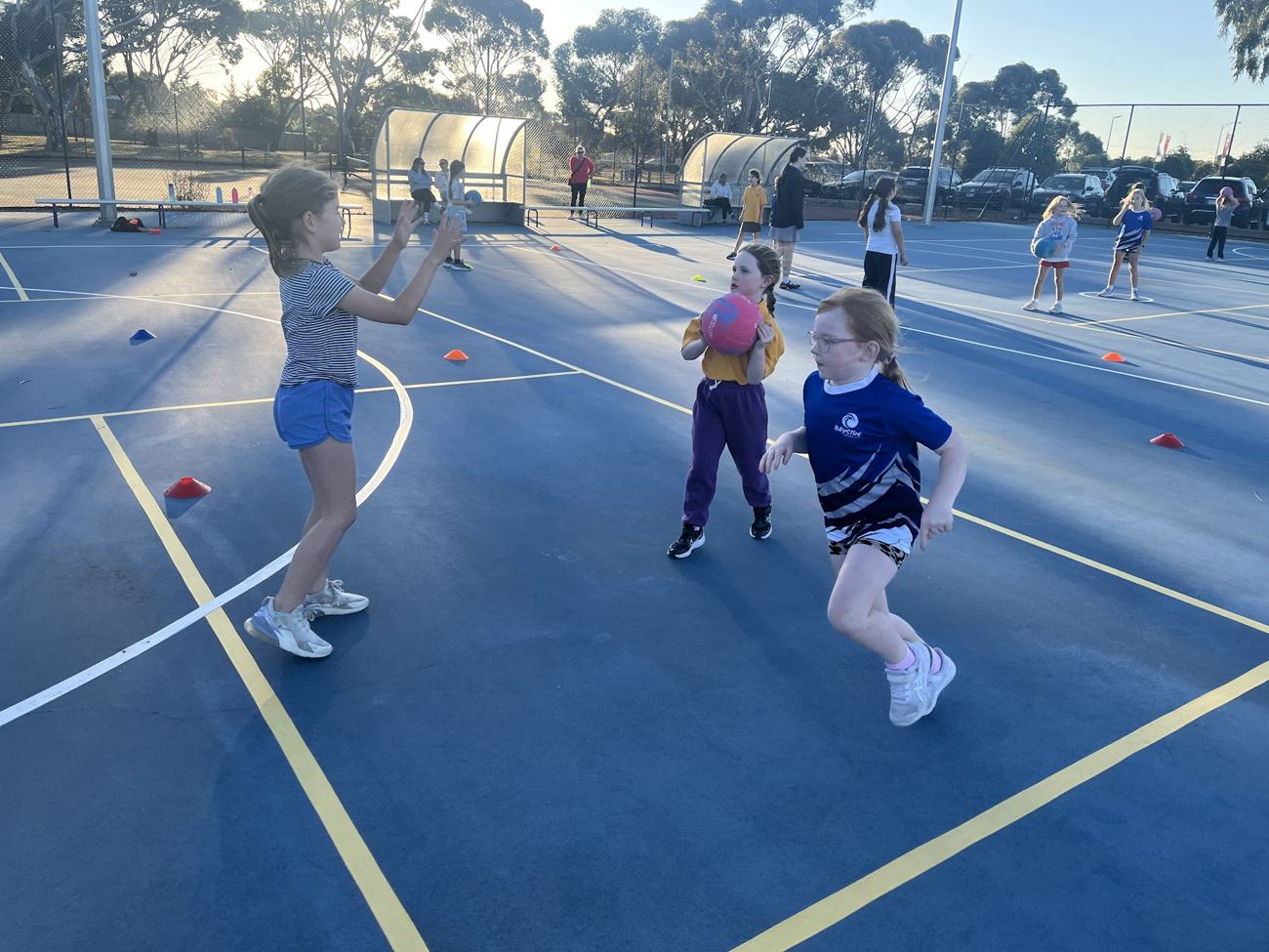 Young players at a training session with cones